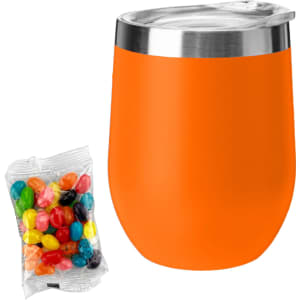 An orange coffee cup with a stainless steel lid alongside a pack of colourful jelly beans.
