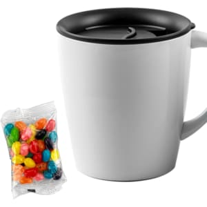 A white mug with a black lid alongside a pack of colourful jelly beans. The mug features a logo.