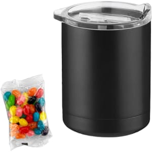 A black coffee mug with a transparent lid beside a pack of colourful jelly beans.