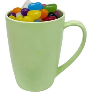 A light green bamboo mug filled with assorted colourful jelly beans and featuring a handle.