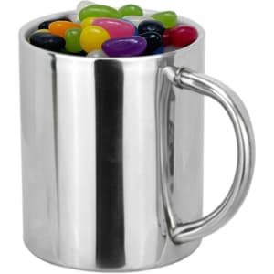 A silver coffee mug filled with colourful jelly beans and featuring a handle.