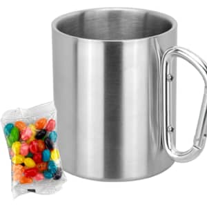 A stainless steel mug with a metal handle, accompanied by a pack of colourful jelly beans.