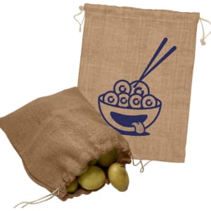 A jute bag in a light brown colour, featuring a design of a bowl with round objects and chopsticks, filled with potatoes.