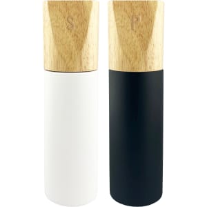 A set of two grinders, one white and one black, with wooden tops featuring engraved letters.