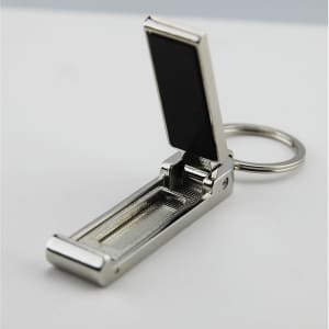 A silver mobile stand and hanger key ring with a sleek, metal design and a black accent.