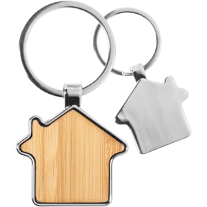 A bamboo house-shaped key ring with a silver metal key ring. Features a smooth wooden surface.