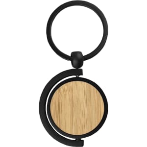 A round bamboo key ring with a black metal attachment, featuring a smooth wooden surface.