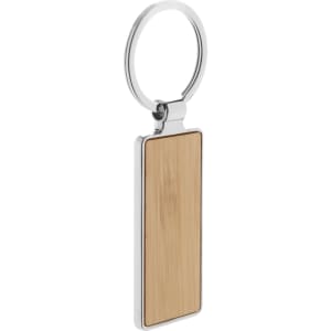 A bamboo keyring with a silver metal ring, showcasing a smooth rectangular shape.