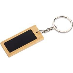 A rectangular bamboo keyring with a black chalkboard-style surface and a silver keyring attachment.