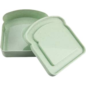 A bamboo sandwich box in a soft green colour, featuring a lid shaped like a slice of bread. Includes a logo.