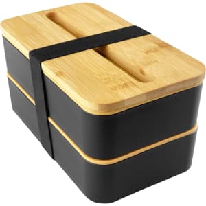 A black bamboo lunch box pack featuring a two-tier design secured with a black strap and a bamboo lid.
