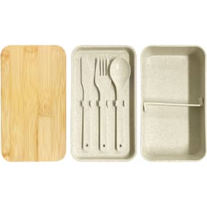 A wheat straw lunch box pack in beige with a bamboo lid and included utensils: fork, knife, and spoon.