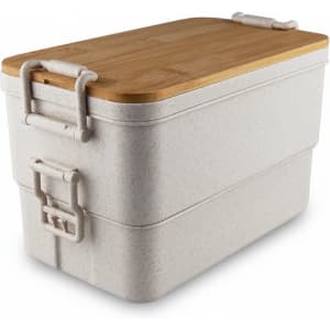 A stackable lunch box in light grey with a bamboo lid and sturdy clips. It features a natural, textured finish.