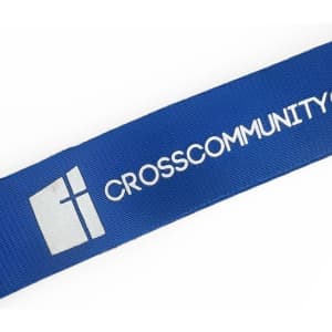 A blue nylon lanyard featuring a logo and the text "CROSSCOMMUNITY".
