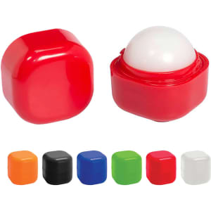 A red lip balm cube with a white applicator top, alongside other coloured cube options including orange, black, green, and blue.
