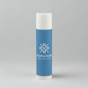 A cylindrical lip balm tube in light blue featuring a white cap and a logo.