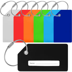A set of silicon luggage tags in various colours: white, red, orange, green, blue, and black, featuring a wire loop.