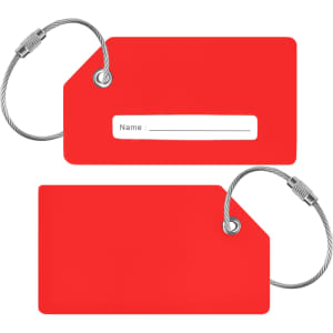 A red silicon luggage tag with a white name label and silver wire loop for attachment.