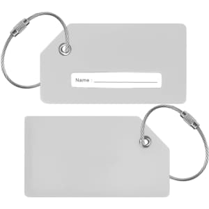 A grey silicon luggage tag featuring a blank name field and secured with a metal loop.