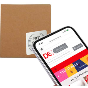 A sticky note pad in a brown kraft envelope with a smartphone displaying a webpage. The envelope features a logo.