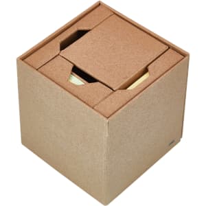 A brown cube-shaped desk organiser holding sticky notes and memo sheets, featuring a simple, textured design.