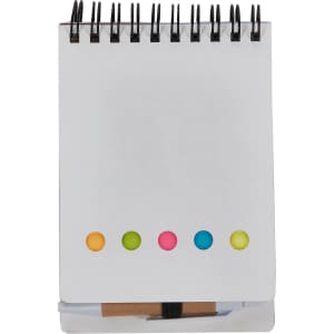 A spiral-bound sticky note pad in white with colourful dots at the top: pink, yellow, and green.