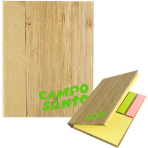 A bamboo sticky notes holder featuring yellow, pink, and green sticky notes. The holder has a logo.
