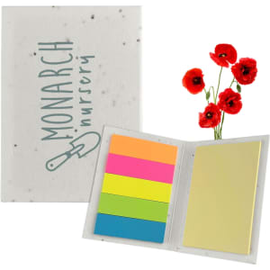 A sticky note pad with a speckled cover featuring a logo, containing colourful sticky notes in pink, orange, green, and yellow.