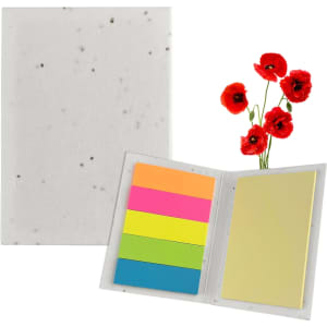 A sticky note pad with a speckled white cover, featuring bright pink, orange, green, and blue sticky notes, alongside red poppy flowers.