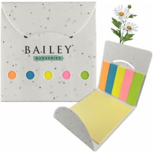 A sticky note pad featuring a floral design with yellow, pink, green, and orange note sections, in a speckled white holder.