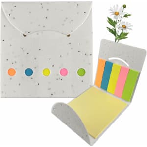 A sticky note pad with a speckled white holder, featuring bright coloured sticky notes and a daisy decoration.