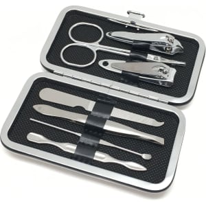 A silver manicure set contains scissors, nail clippers, tweezers, and other grooming tools in a compact case.