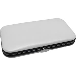 A white and black manicure set case featuring a smooth exterior and a silver clasp.