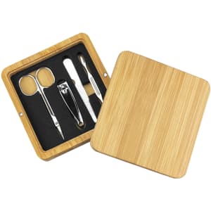 A bamboo manicure set with scissors, nail clippers, and a cuticle tool, presented in a wooden box.
