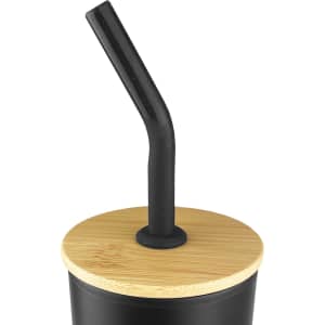 A black travel mug with a bamboo lid and a black straw. It features a logo on the side.