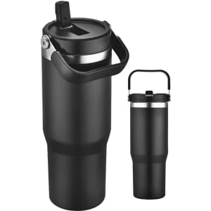 A travel mug in black with a silver rim and a handle, featuring a flip-top lid and a logo.