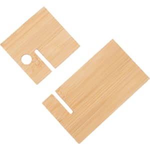 A bamboo phone holder in light brown, featuring two pieces with cut-outs for device support and cable management.