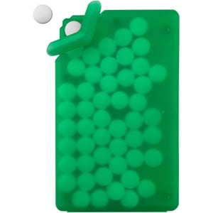 A green silicone card holder filled with white sugar-free mint tablets, with one tablet positioned above the holder.