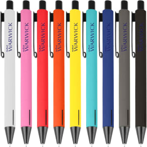 A collection of metal pens in white, pink, orange, yellow, and black, featuring clip attachments and brand logos.