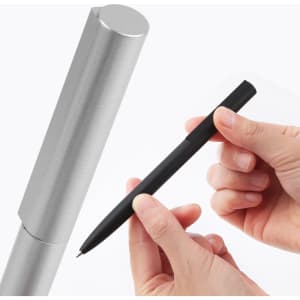 A silver metal pen case with a black metal pen held between fingers. The pen has a sleek design.
