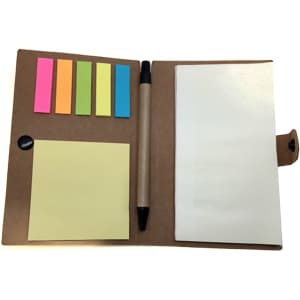 A brown notebook opens to reveal adhesive marker note pads in yellow, pink, green, and blue, with a pen included.