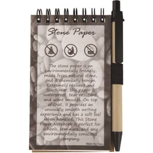 A Stone Paper Notebook with a spiral binding, accompanied by a black pen, featuring a textured design of stones.