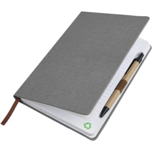 A5 textured grey PU notebook with a leather-like cover and a pen attached. Eco-friendly design with blank lined pages.