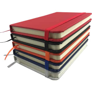A6 Handy PU Notebooks in various colours stacked together, featuring elastic closures and ribbons.