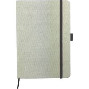 A cotton notebook in light grey with a black elastic closure and ribbon bookmark, featuring a logo.