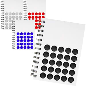 A selection of Diano Bubble Notebooks in white, featuring coloured bubble designs in black, red, blue, and grey.