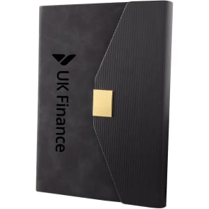 A sleek black notebook with a textured cover and a gold clasp, featuring a logo on the front.
