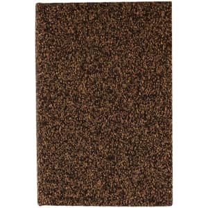 A brown notebook with a textured cover resembling coffee grounds. It features a logo on the front.