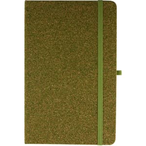 A green notebook with a textured cover and an elastic band closure, featuring a logo on the front.