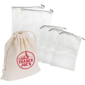 A set of four white nylon mesh produce bags alongside a beige cotton drawstring bag with a logo.